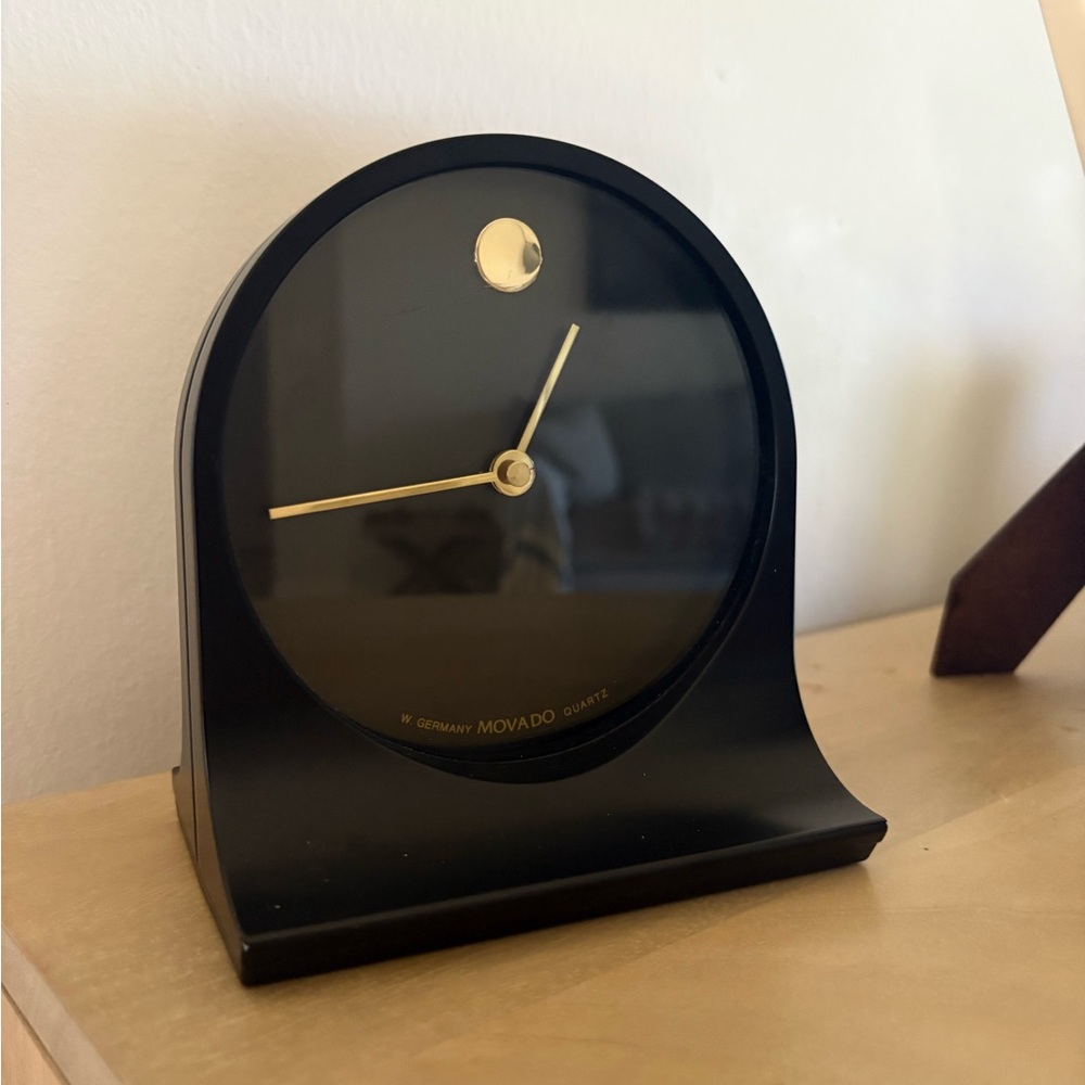 Movado Elegant Black and Gold Wall Clock
